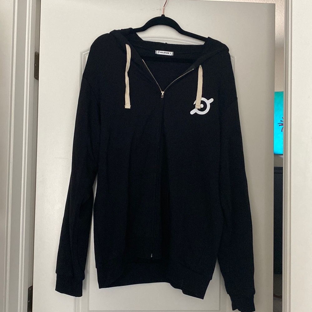 Never worn peloton hoodie with flower pattern
